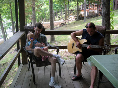 Uncle Danny serenades his niece on their back portch after dinner